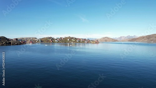 A typical small Inuit village (settlement) in Greenland. Filmed during the summer on a sunny day. photo