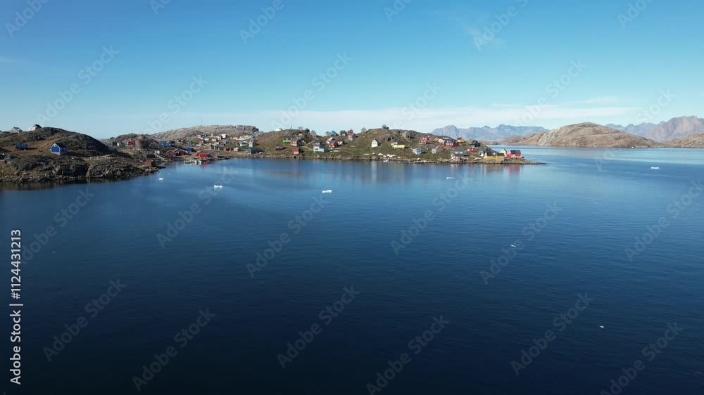 A typical small Inuit village (settlement) in Greenland. Filmed during the summer on a sunny day. A typical small Inuit village (settlement) in Greenland. Filmed during the summer on a sunny day.
