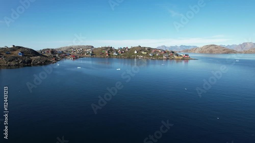 A typical small Inuit village (settlement) in Greenland. Filmed during the summer on a sunny day.