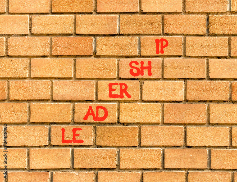 Leadership symbol. Concept word Leadership on beautiful brown bricks. Beautiful brown brick wall background. Business leadership concept. Copy space. Leadership symbol. Concept word Leadership on beautiful brown bricks. Beautiful brown brick wall background. Business leadership concept. Copy space.