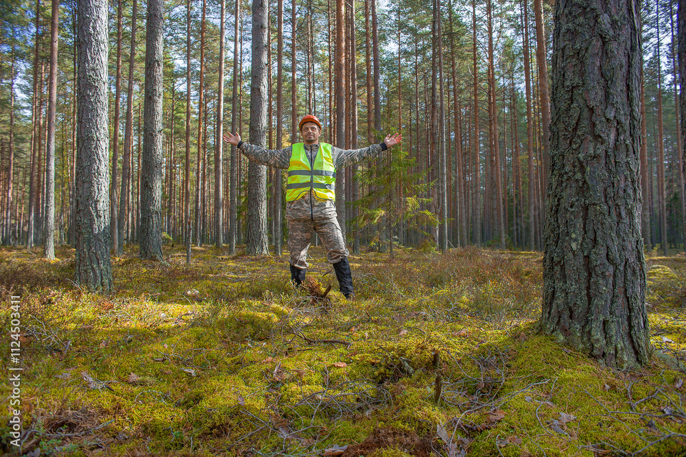 Forest engineer, ecologist stands in the forest. Forest engineer, ecologist stands in the forest.