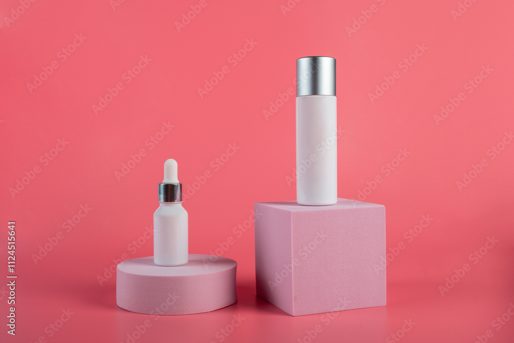 Plastic white tube for cream or lotion. Skin care or sunscreen cosmetic with stylish props on pink background. Plastic white tube for cream or lotion. Skin care or sunscreen cosmetic with stylish props on pink background.