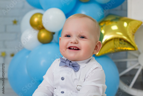 Adorable One-Year-Old Boy Celebrating First Birthday in Blue Decor