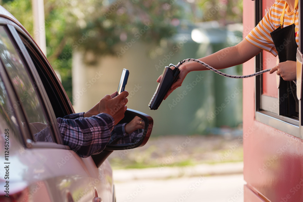 Men scan and pay for food, pick up food from a drive-thru counter and take it to eat at home and at work Men scan and pay for food, pick up food from a drive-thru counter and take it to eat at home and at work