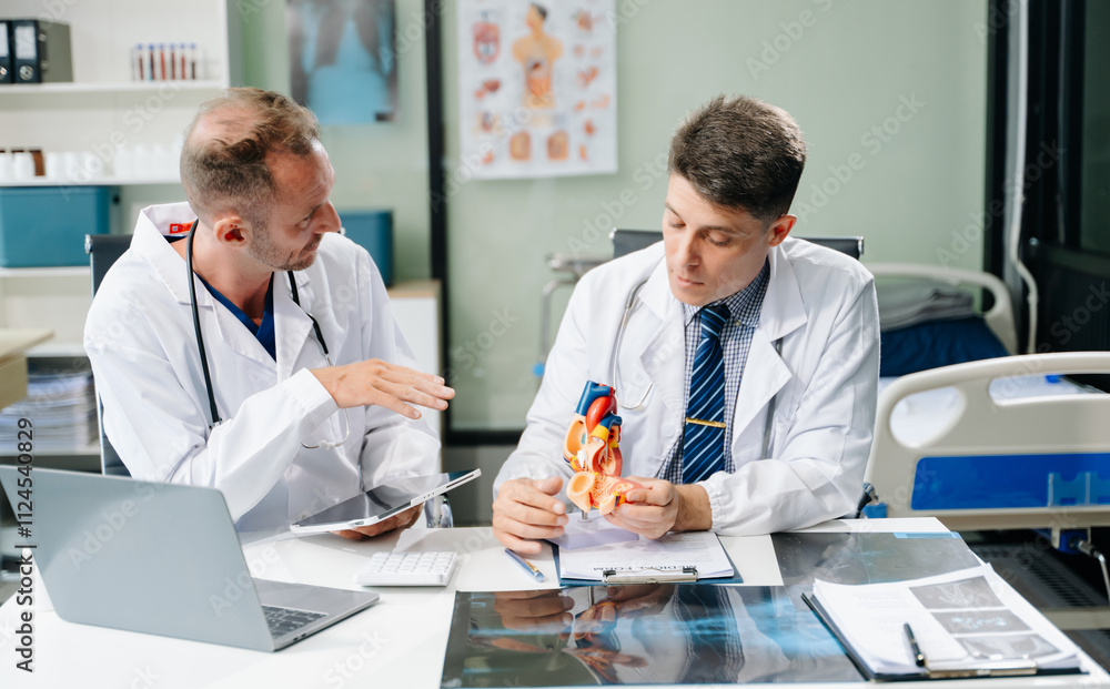 Doctors analyzing an X-ray, collaborating with digital tools in a medical office. Showcasing teamwork, diagnostic Doctors analyzing an X-ray, collaborating with digital tools in a medical office. Showcasing teamwork, diagnostic