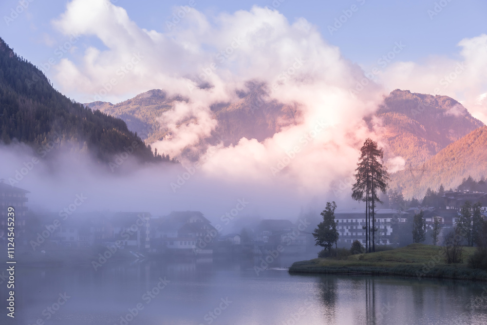 Alleghe, Veneto, Italy houses and lake, fog
