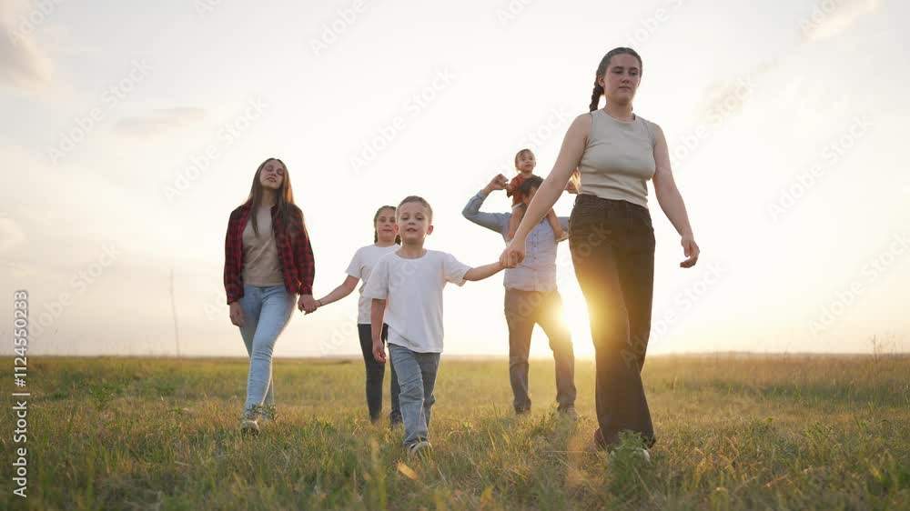 Family walking together nature at sunset. Parents children enjoying the outdoors. Creating memories nature. Family bonding embracing success. Happy family moments sunset. Children parents together. Family walking together nature at sunset. Parents children enjoying the outdoors. Creating memories nature. Family bonding embracing success. Happy family moments sunset. Children parents together.