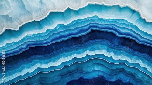 A close-up of layered blue agate showcasing stunning patterns and rich hues, creating a mesmerizing natural artwork.