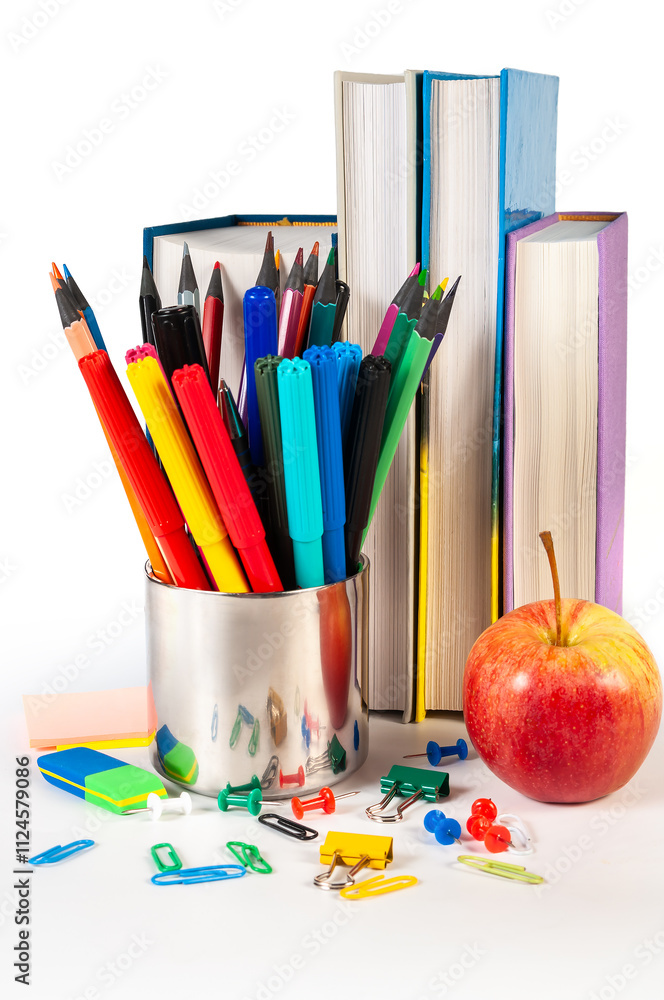 Fototapeta premium Colorful office supplies including stapler, clips, and push pins