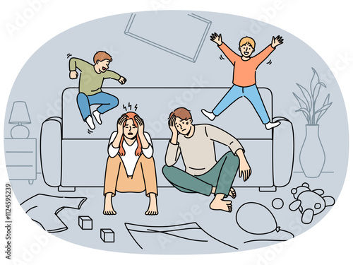 Tired parents sit on floor while mischievous children jump on sofa and throw things around house. Frustrated mom and dad cant cope with parental responsibilities and cant control hyperactive children