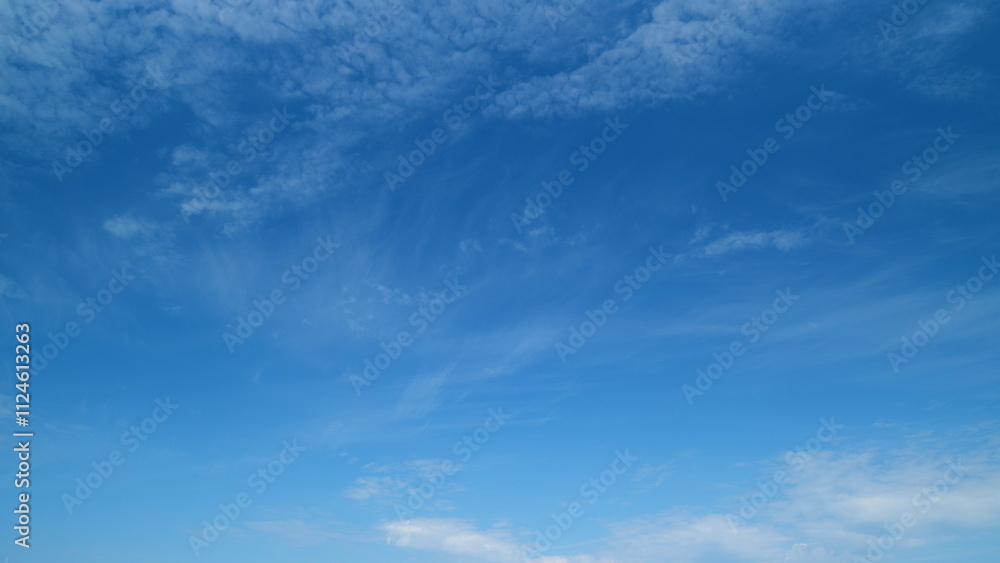 Obraz premium Sky with several layers of clouds moving in different directions. Sun rays at sunshine day. Timelapse.