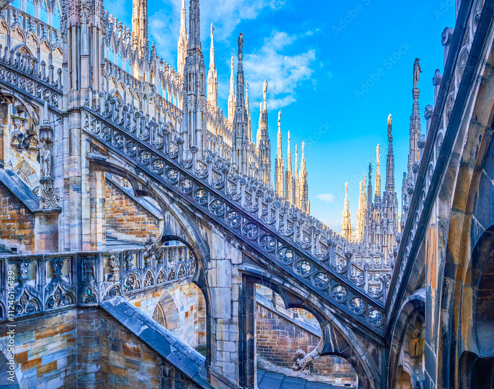 Milan Cathedral is a Gothic masterpiece with ornate spires, intricate sculptures, and detailed carvings, Italy Milan Cathedral is a Gothic masterpiece with ornate spires, intricate sculptures, and detailed carvings, Italy