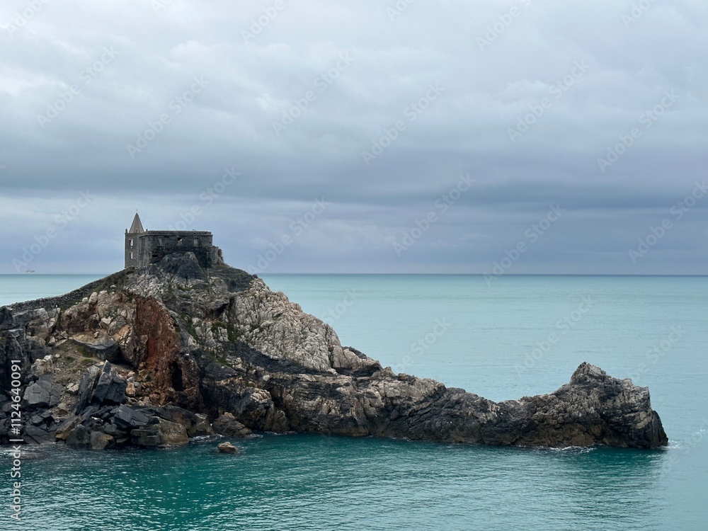 View of the coast of the Mediterranean Sea with Chiesa de San Pietro church in Portovenere, Le Grazie, Liguria, Italy, October 2023