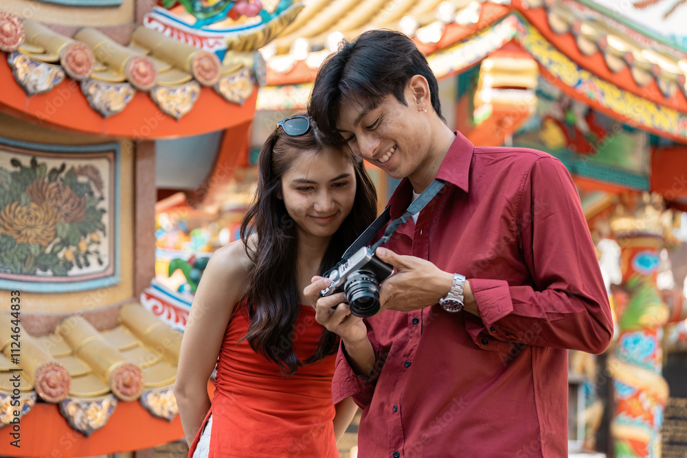 Obraz premium Celebrating chinese new year a young couple captures joyful moments at a colorful festival outdoor setting candid