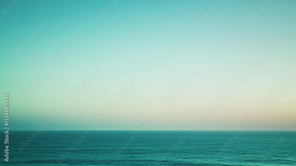 Fototapeta premium A soft, blurred image of the ocean and sky at sunset in pastel colors.