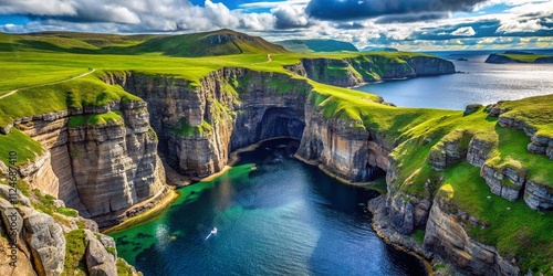 Aerial View of Smoo Cave and Geodha Smoo Fjord in Durness, Northern Highlands, Scotland: Majestic Cliffs and Serene Waters Captured from Above photo