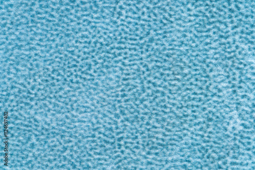 Blue color velvet or velour with short haired fluffy and soft texture background. Cerulean colour surface level textile material, colored background fabric texture, free copy space for creative design photo