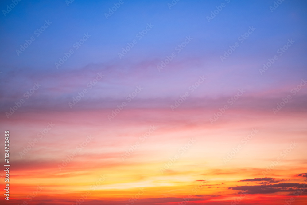 Fototapeta premium Sky,sunset, beautiful , luxury soft gradient orange gold clouds and sunlight on the blue sky perfect for the background, Sunrise on morning or evening in winter warm time ,Twilight summer,silhouette