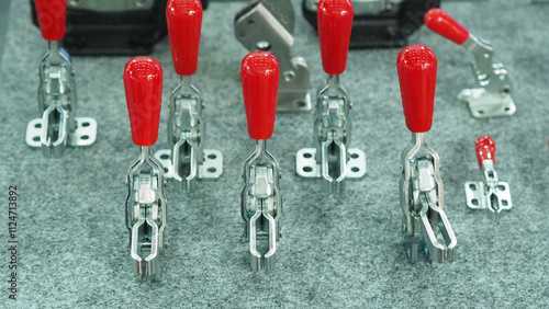 Photos Manual and pneumatic hold down clamping tool.