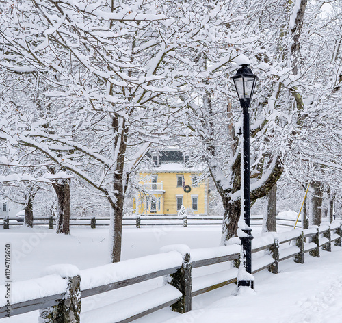 A yellow house in the snow