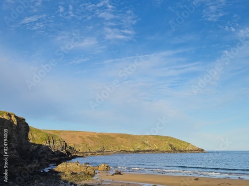 Coastal Landscape with Water, Sky, and Mountains