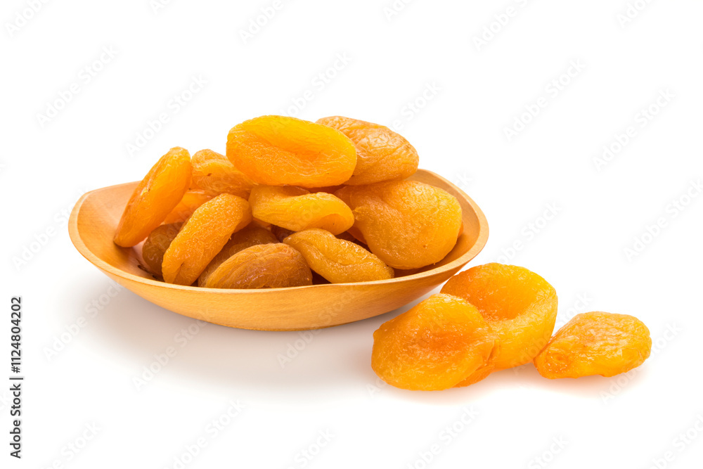 Dried apricots in and out of bowl on white background Dried apricots in and out of bowl on white background