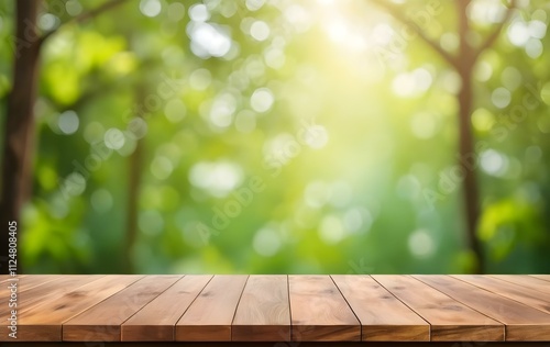 Wooden table with shadow background of green leaves in sunlight