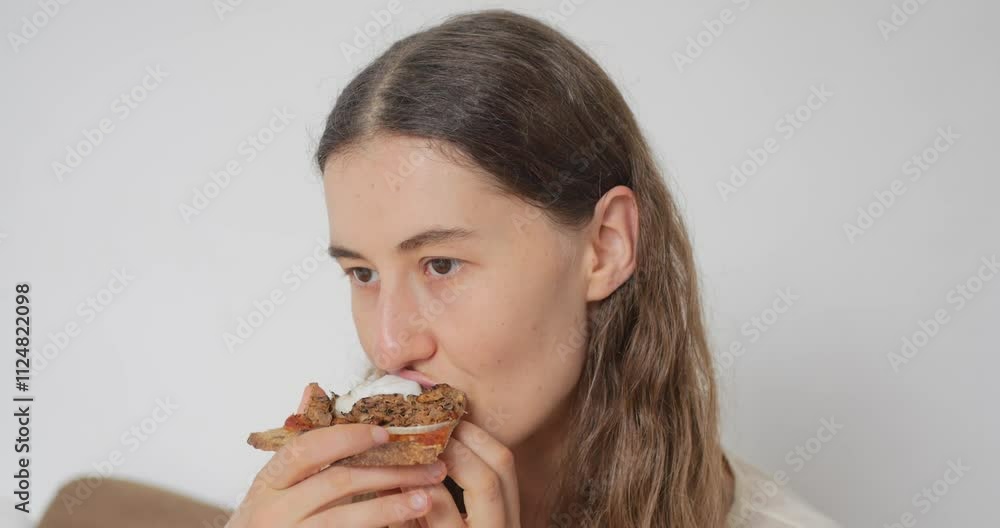 Young Blonde Woman Eating Vegan Pizza. Closeup. Young Blonde Woman Eating Vegan Pizza. Closeup.