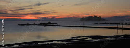 Sunrise over Lake Vanern seen from Vita Sandar, Sweden. photo