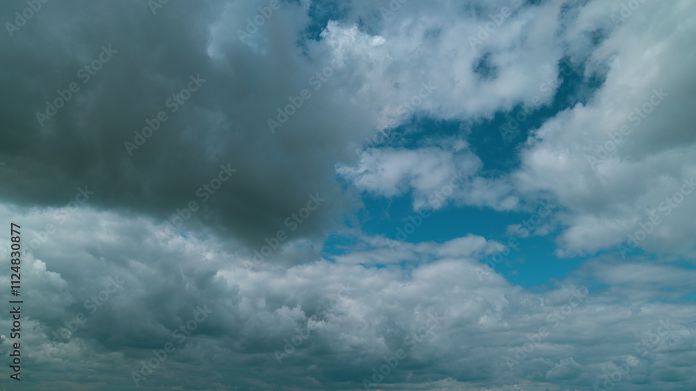 Obraz premium Gray Rainy Clouds Float Across Dark Sky. Tornado Clouds. Natural Background. Rainy Sky.