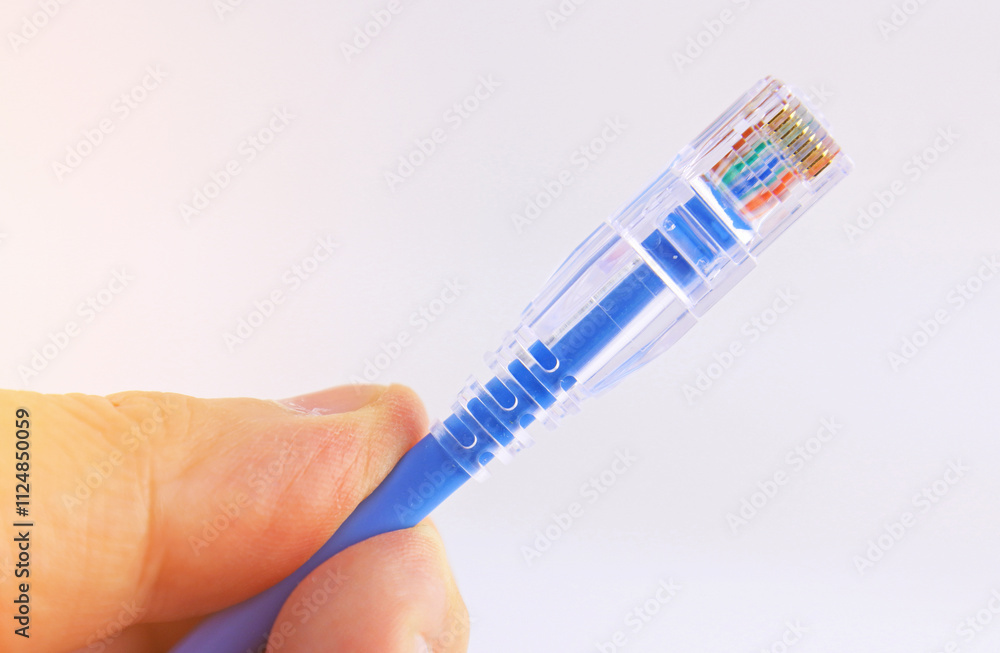 Obraz premium Rj45 connector for connecting a twisted pair cable. Data transmission over Ethernet.
