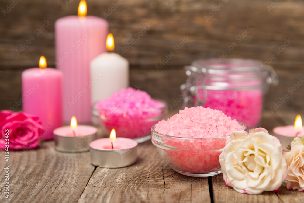 Sea salt for bath with aroma and rose flowers on textured wooden background. Pink sea salt. Spa treatments. Natural salt with herbs and essential oils. skincare concept. Meso for text. Copy space Sea salt for bath with aroma and rose flowers on textured wooden background. Pink sea salt. Spa treatments. Natural salt with herbs and essential oils. skincare concept. Meso for text. Copy space