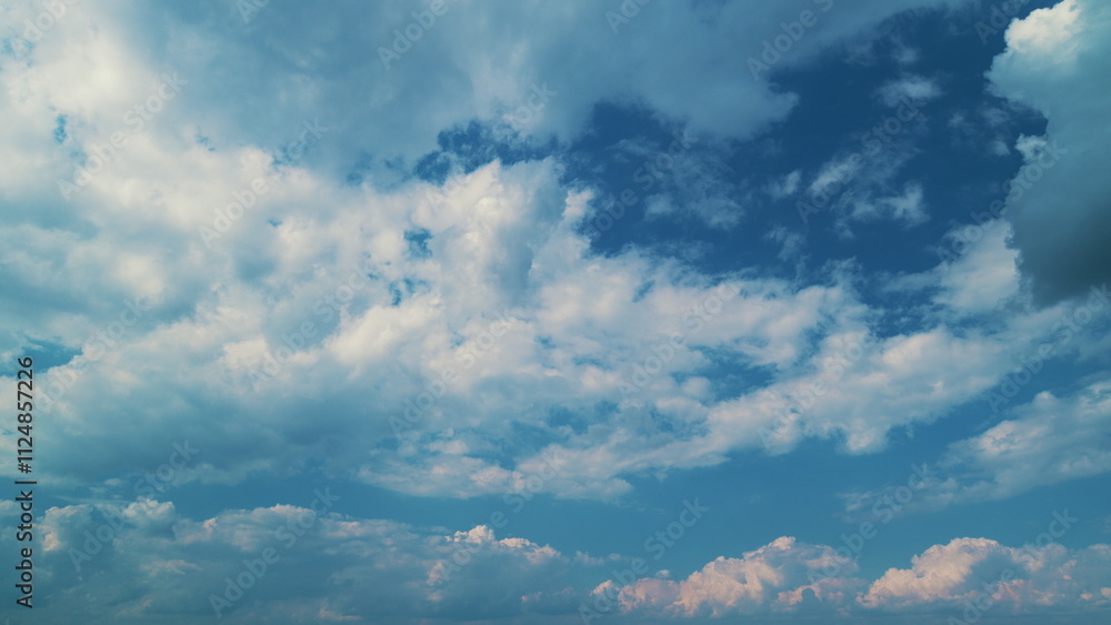 Obraz premium Cumulus Cloud Cloudscape. B Roll Blue Sky And Gray Cloud. Summer Blue Sky. White Clouds Background.