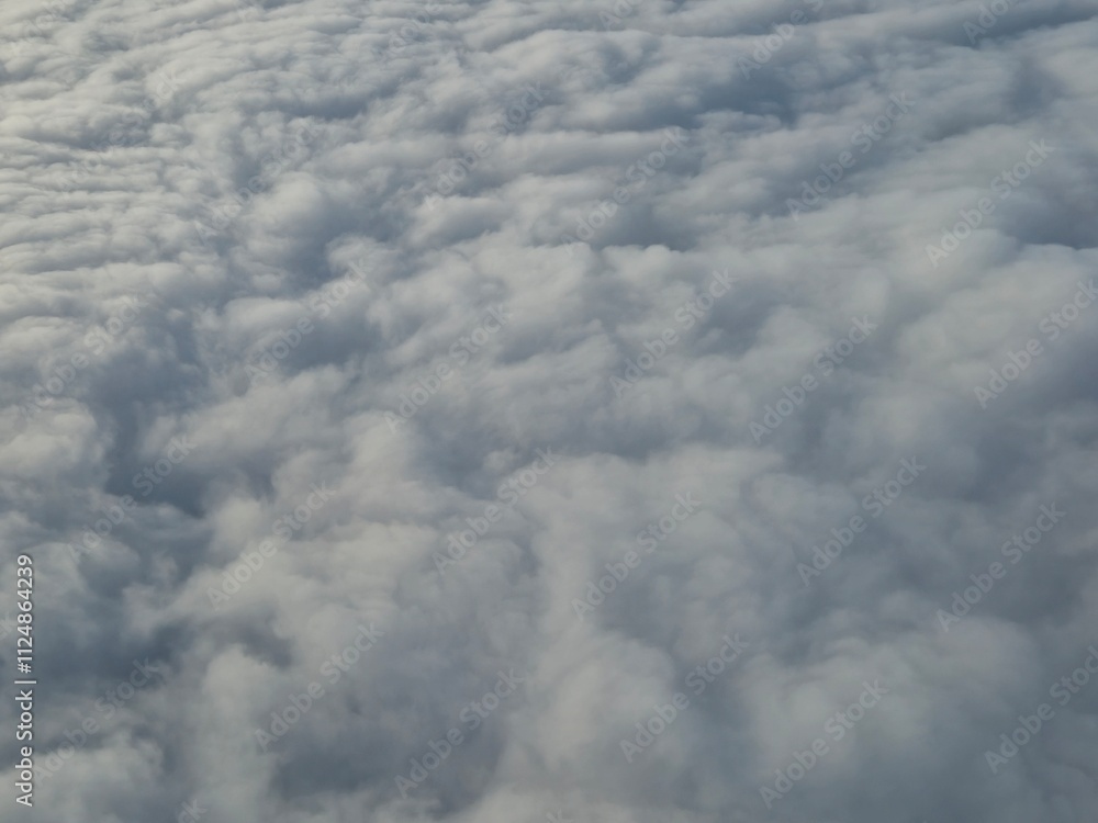 Airplane flying over white clouds background Airplane flying over white clouds background