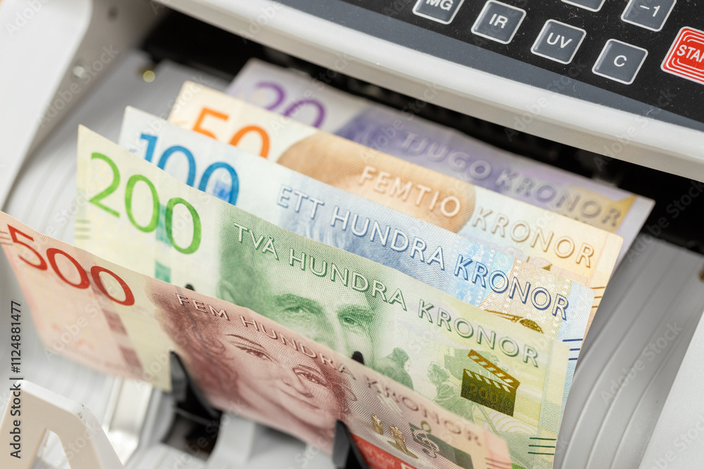 Sweden money. Money counting machine with Swedish kronor. Business concept. Financial operations, exchange, currency, close up
