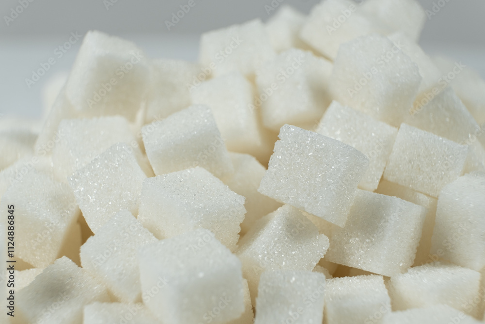 Cubes of white crystalline beetroot refined sugar. Cubes of white crystalline beetroot refined sugar.