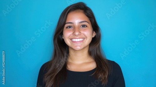 Smiling Young Woman with Long Hair Against Turquoise Background