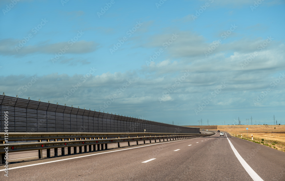 Fototapeta premium A highway with a sound barrier.