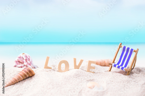 love wooden text on white sand beach with tropical blue sea and clear blue sky