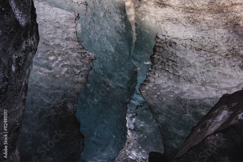 View on cracked ice in ice cave, Southern Iceland. Blue pattern, texture