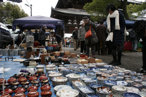 Japanese porcelain dishes on sale at the famout Kobo Market in Kyoto. Imari ware produced in the town of Arita at the Kyushu Island, colorful, decorative ceramic plates and urushi lacquerware.