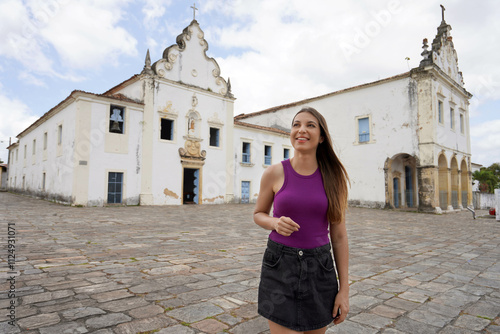 Cute Brazilian woman walking in Praca do Carmo in the old town of Sao Cristovao, Sergipe, Brazil photo