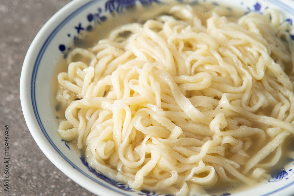 Kalguksu noodles in a bowl, handmade noodles Kalguksu noodles in a bowl, handmade noodles