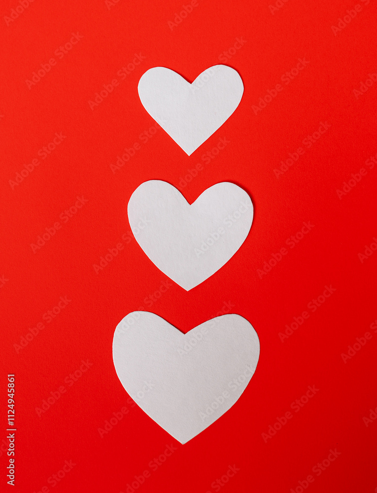 White paper hearts on red background for happy valentines day White paper hearts on red background for happy valentines day