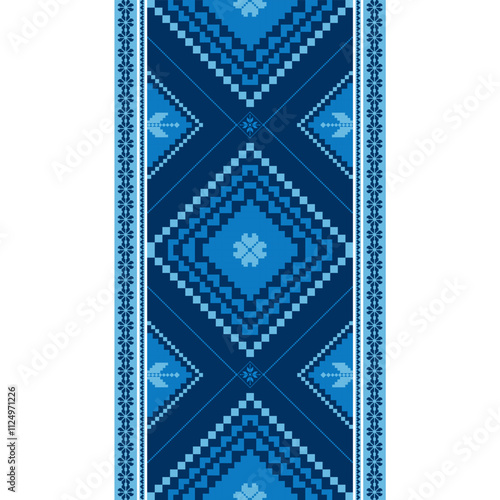 A blue and white patterned rug with a blue diamond design