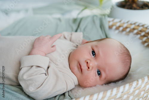 Portrait of 2 weeks old baby. Healthy physical and mental development of child. photo