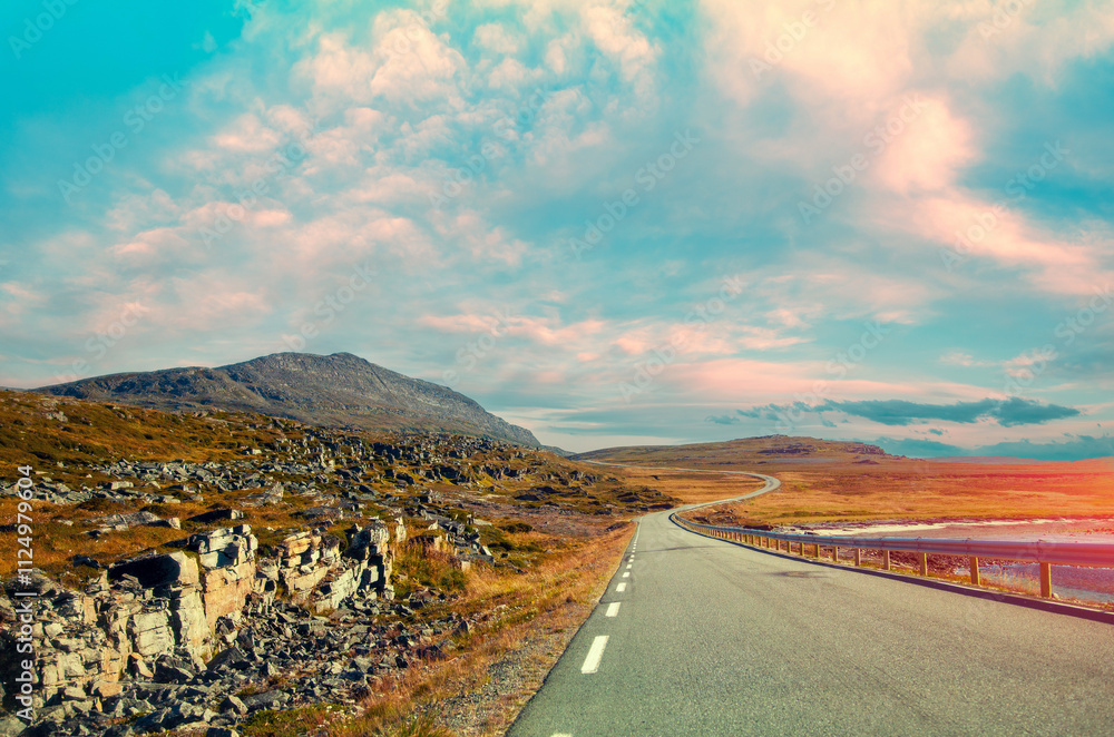 Driving a car on mountain road. Nature Norway. Polar circle. The way to Nordkapp