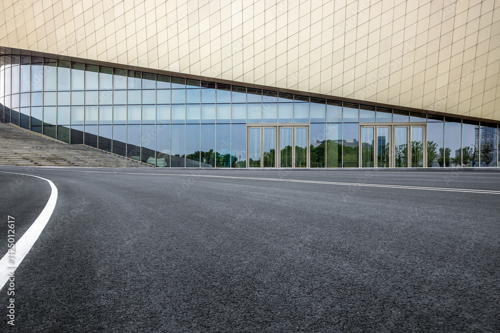 Empty asphalt road and office buildings in modern city Empty asphalt road and office buildings in modern city