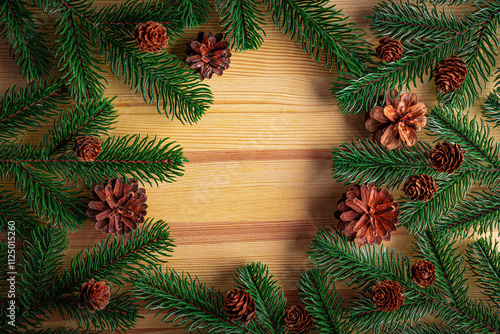 Obraz na płótnie Christmas background. Fir branches on a wooden background. New Year and Christmas decorations as a festive background. w salonie