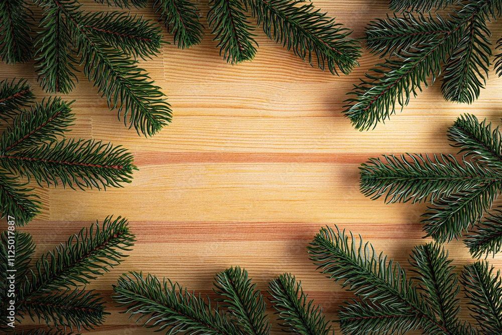 Christmas background. Fir branches on a wooden background. New Year and Christmas decorations as a festive background.